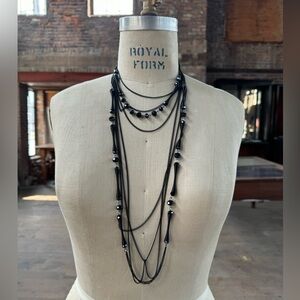 2 jet and metal necklaces